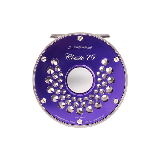 Purple fishing reel spool with perforated ring and circular center opening