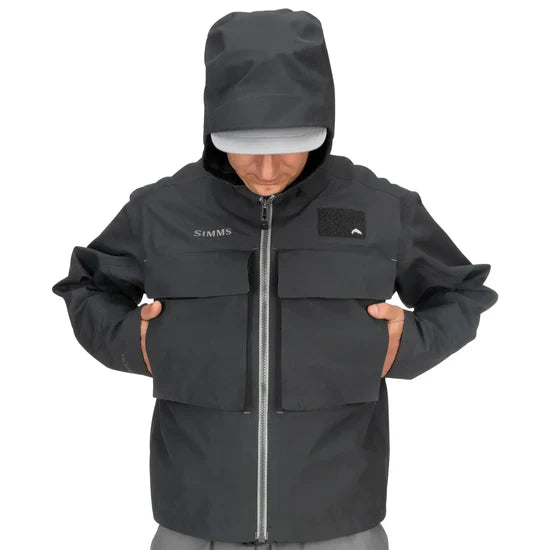 Load image into Gallery viewer, Men's dark jacket with hood up, full zipper, and chest flap pockets
