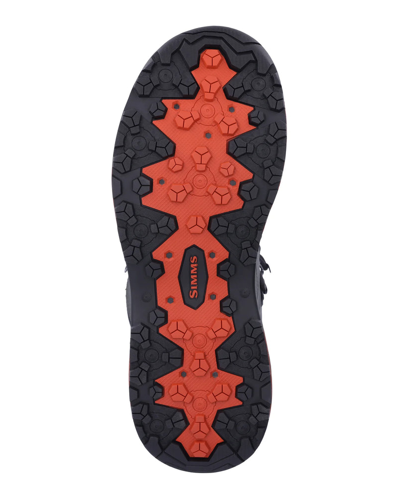 Load image into Gallery viewer, Simms Freestone boot outsole tread, dark rubber with orange traction pattern.
