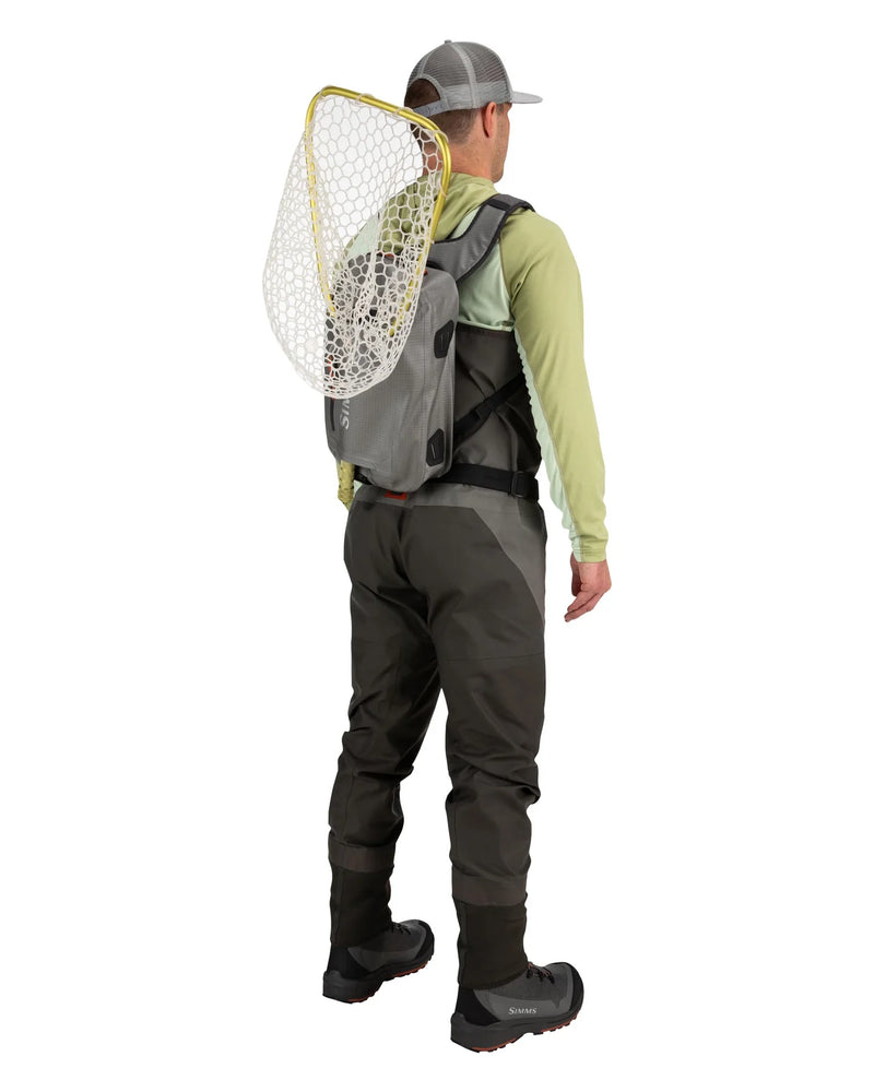 Load image into Gallery viewer, Olive-gray sling backpack worn crossbody with mesh front pocket
