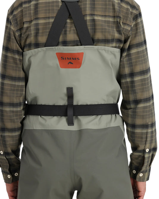 Simms Freestone Z back harness wader in gray with black straps and Simms logo patch