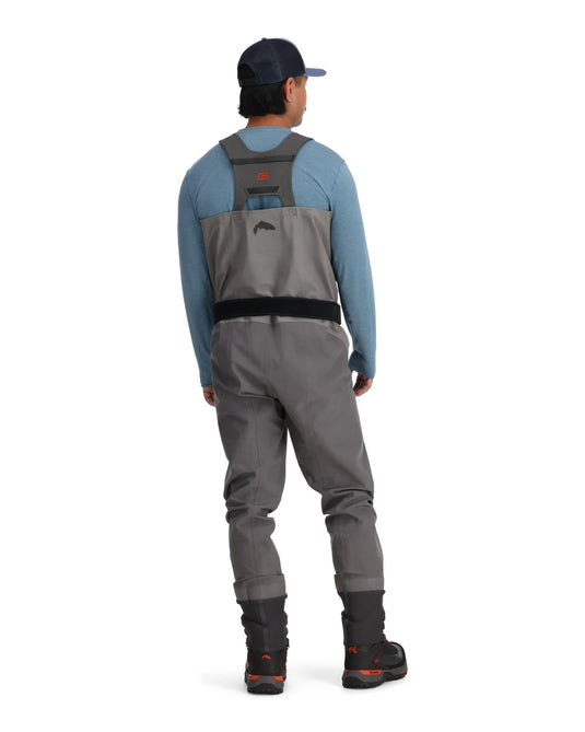 Gray stockingfoot waders shown from back with shoulder straps and black booties