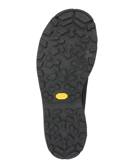 Men’s guide boot outsole with deep tread pattern and small yellow brand patch