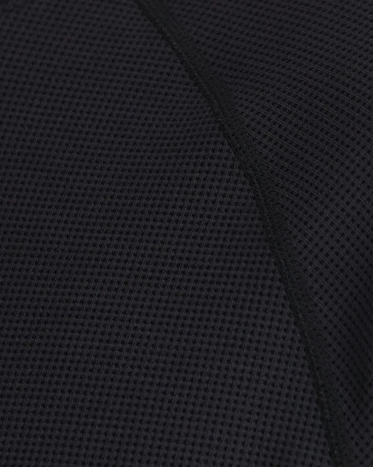 Black textured knit hoodie fabric close-up