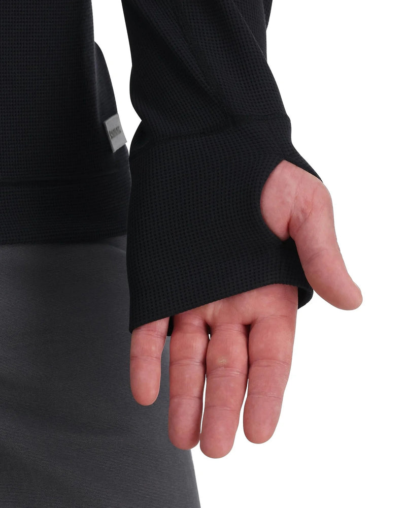 Load image into Gallery viewer, Black hoodie sleeve and cuff with small logo patch at hem
