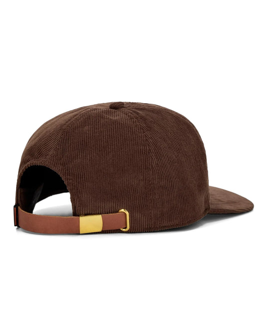 Brown corduroy cap with adjustable leather strap on underside