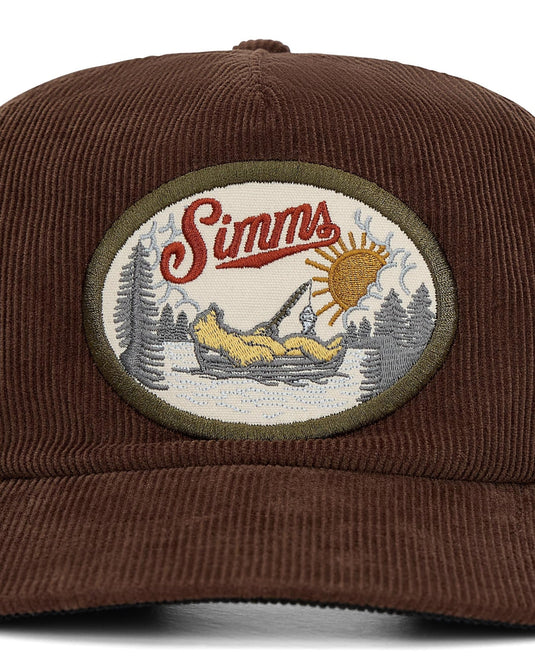 Brown corduroy cap with circular Simms logo patch on front