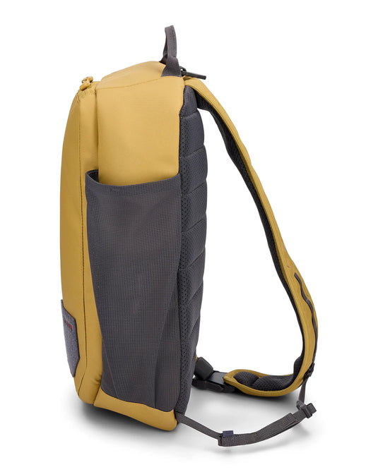 Simms Tributary sling pack, tan body with gray side mesh panel and long shoulder strap