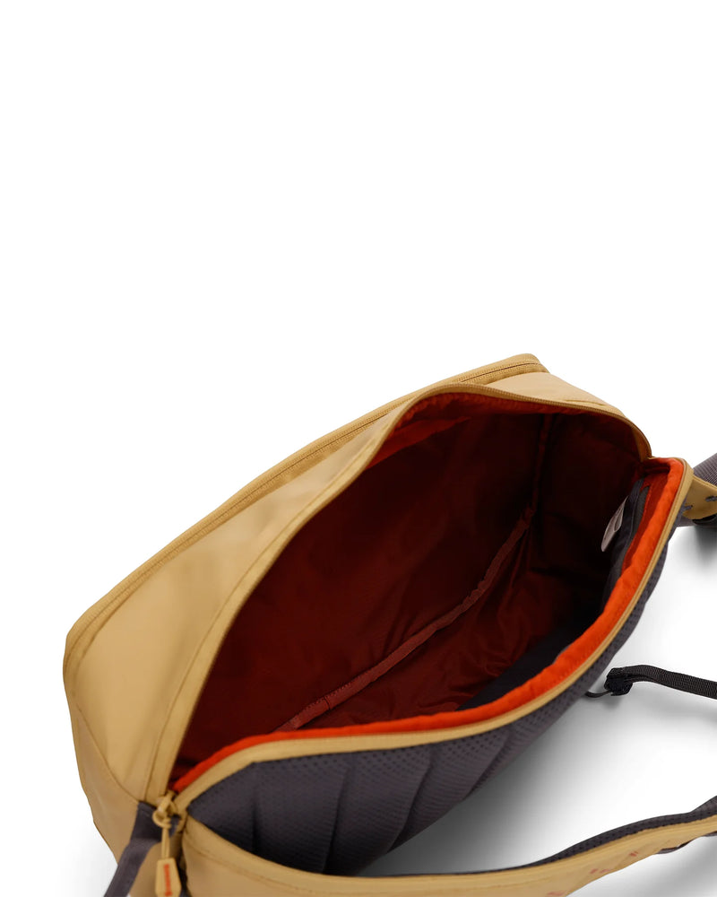 Load image into Gallery viewer, Simms Tributary sling pack, open top showing red interior lining and dark organizer insert

