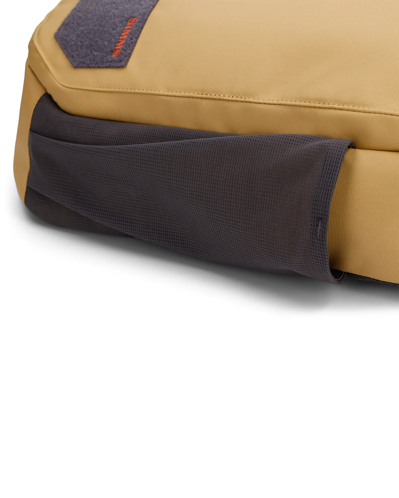 Load image into Gallery viewer, Simms Tributary sling pack, close-up of gray mesh pocket panel on tan body
