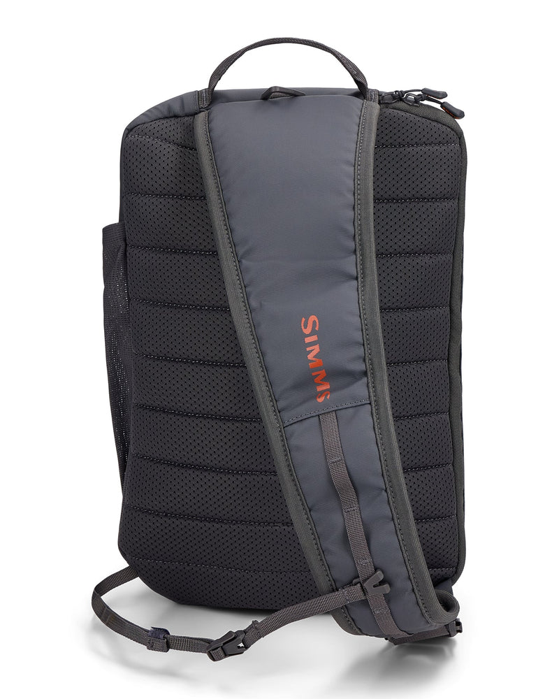 Load image into Gallery viewer, Simms Tributary sling pack, dark back panel with padded straps and top carry handle
