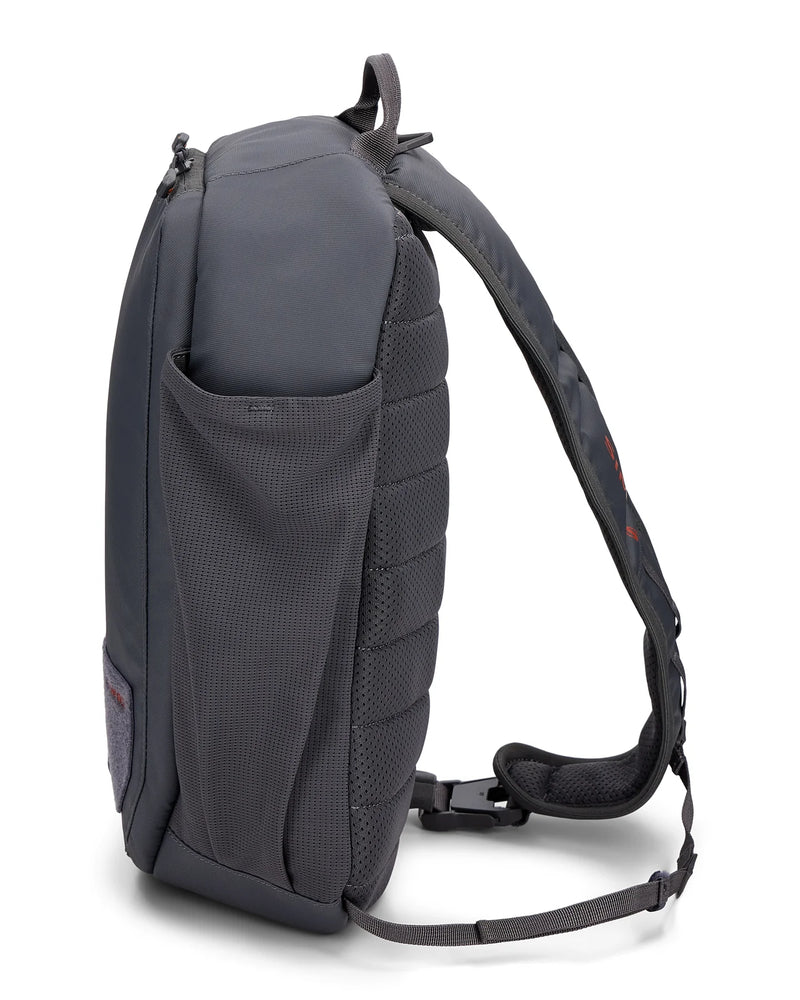 Load image into Gallery viewer, Simms Tributary sling pack, dark side view with mesh pocket and padded shoulder strap
