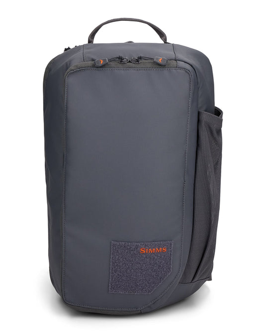 Simms Tributary sling pack, dark front with side mesh pocket and Simms logo patch