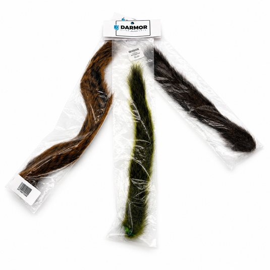 Set of squirrel tails in clear bags: brown, green, and dark grey fur tufts