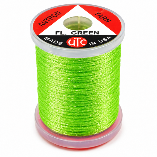 Yarn spool with fluorescent green thread, UTC label on top
