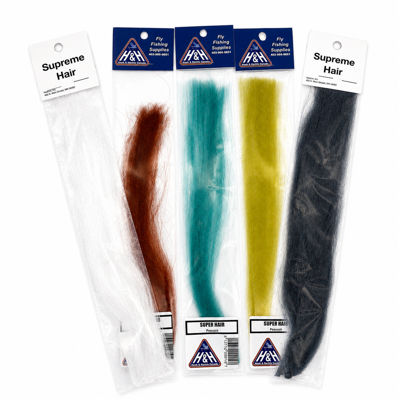 Load image into Gallery viewer, Fly-fishing hair assortment with white, brown, teal, yellow-green, and black strands
