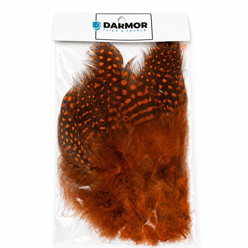 Load image into Gallery viewer, Guinea fowl feathers in orange with black speckles, sealed in a bag.
