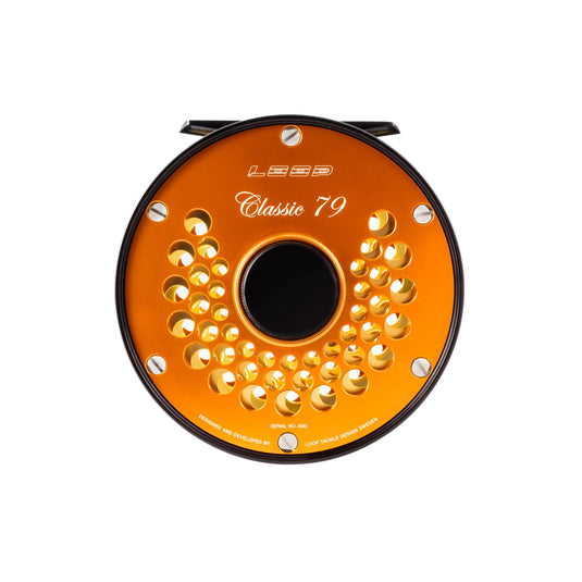Fly fishing reel, orange spool with perforated face and Classic 79 marking