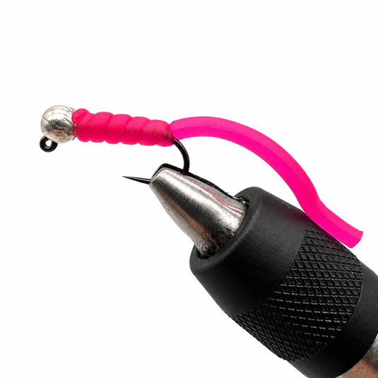 Pink squirmy worm fishing lure with slotted tungsten head, metal bead, and barbed hook