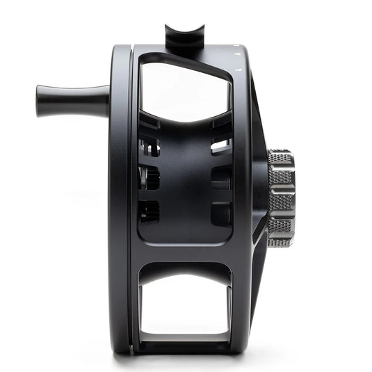 Fly fishing reel back view with frame cutouts and textured adjustment wheel