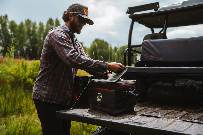 Load image into Gallery viewer, Duskwood cooler bag on a table with lid open and interior ready for packing
