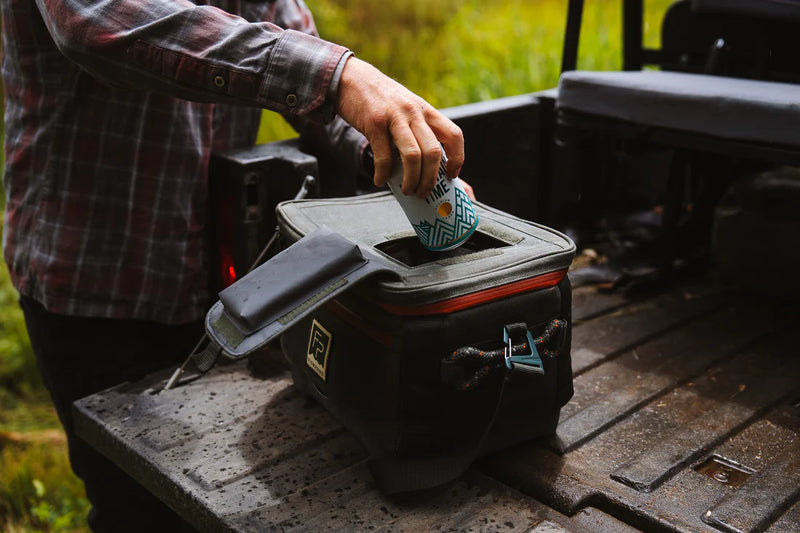 Load image into Gallery viewer, Duskwood cooler bag with lid open on a table, showing interior compartment
