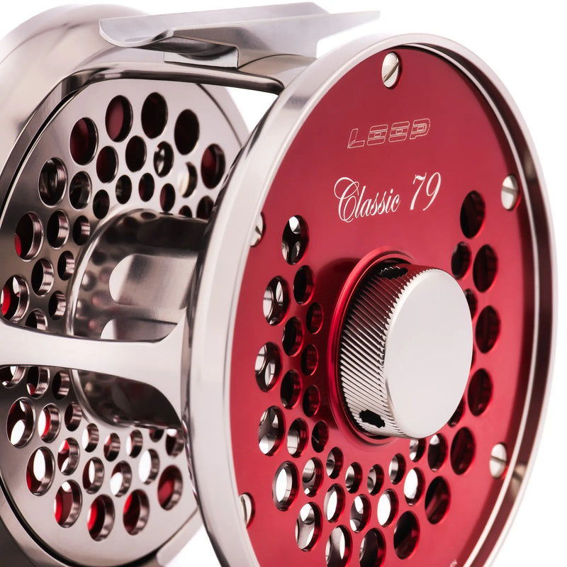 Load image into Gallery viewer, Fly fishing reel, red spool with perforated disc and metal handle side

