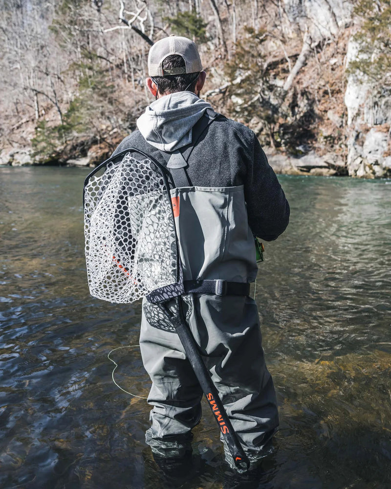 Load image into Gallery viewer, Landing net with white mesh bag and black frame, attached to waders
