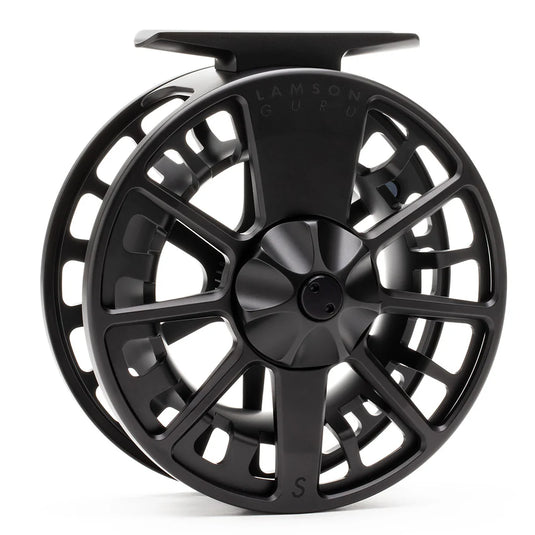 Black fly fishing reel showing 'LAMSON GURU' lettering on spool support