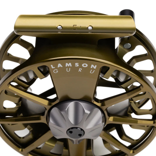 Olive gold fly fishing reel top view with 'LAMSON GURU' and 5+ marking