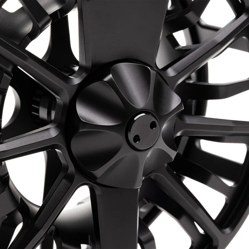 Load image into Gallery viewer, Close-up of black fly fishing reel hub with spoke arms.
