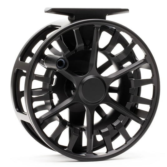 Black fly fishing reel with arched frame and central spool.