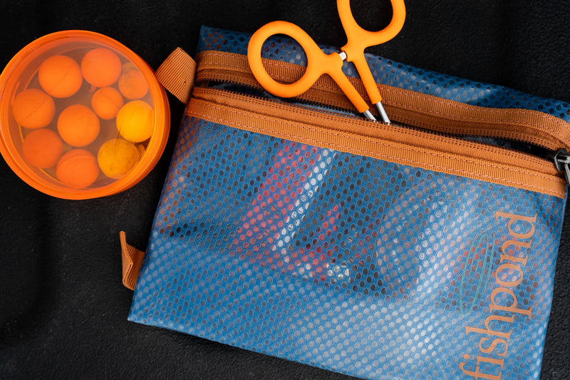 Load image into Gallery viewer, Fishpond travel pouch, blue mesh with orange zipper and front pocket
