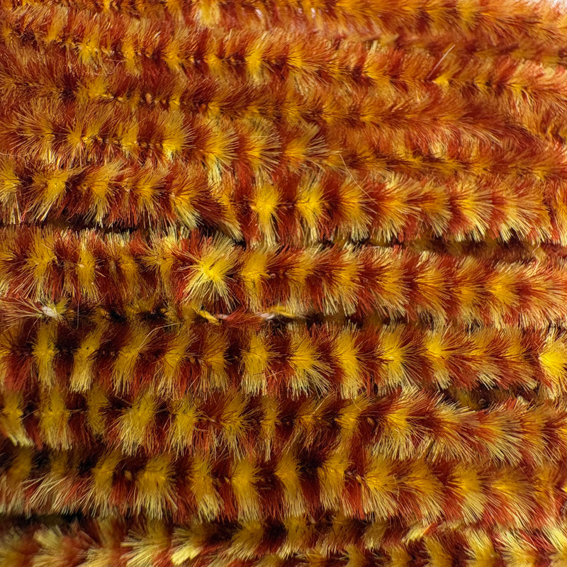Load image into Gallery viewer, Hook &amp; Hackle variegated chenille in golden yellow and rust orange loops
