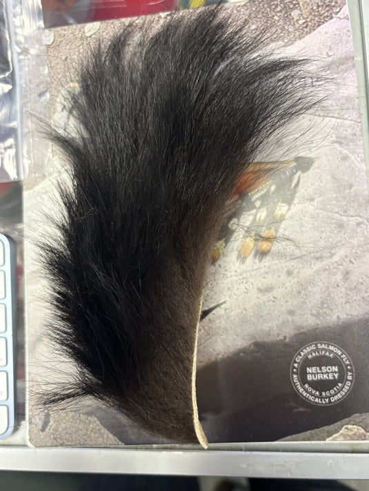 Faux fur tail trim with black bear design