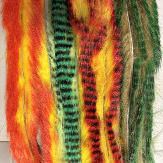 Multicolor rabbit fur strips with red, yellow, green, and dark striped fibers