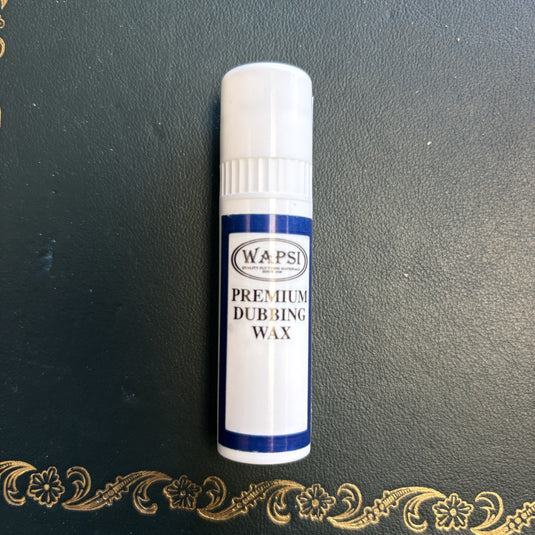 Premium dubbing wax tube with blue-and-white label, cylindrical white cap