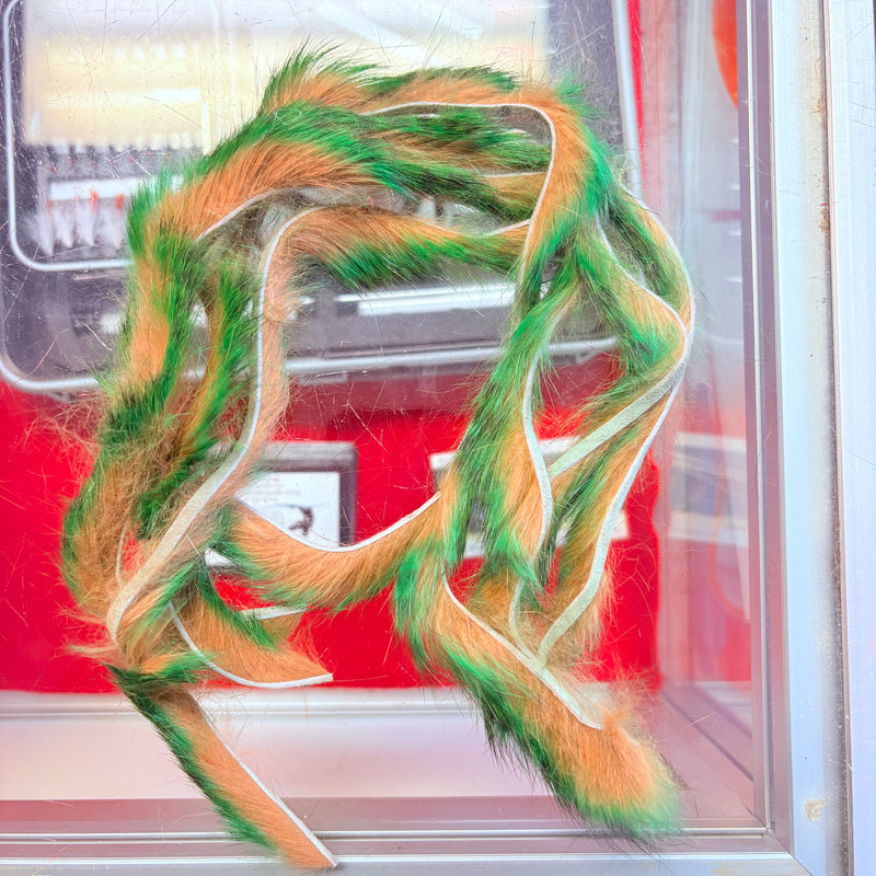 Load image into Gallery viewer, Fishing rabbit fur strips in green and orange with tan speckles, looped
