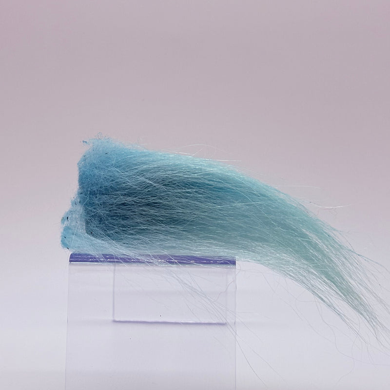 Load image into Gallery viewer, Polar bear plush in light blue faux fur tuft.
