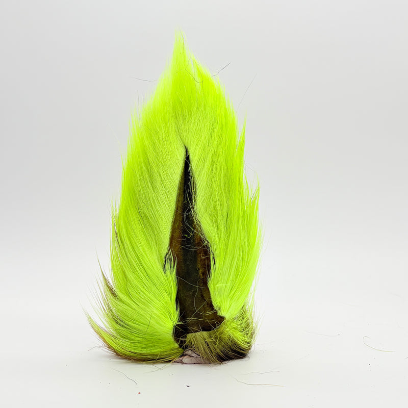 Load image into Gallery viewer, Neon green bucktail-style fly tail with dark mottled base
