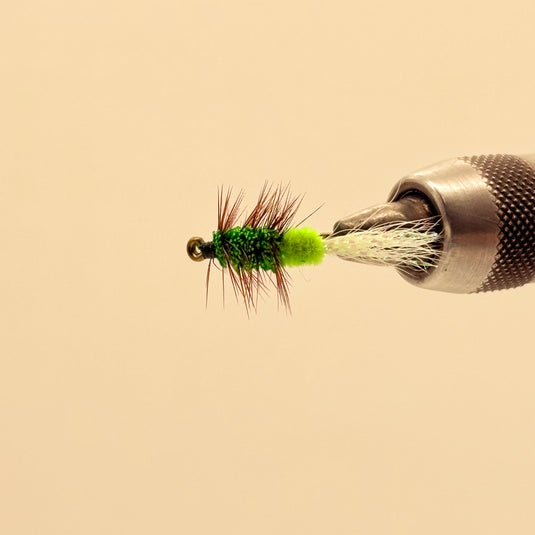Fishing lure with lime foam body, green dubbing, sparse red-brown tail, white wing