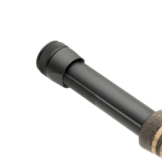 Fly fishing rod handle close-up with textured black grip and cork end ring