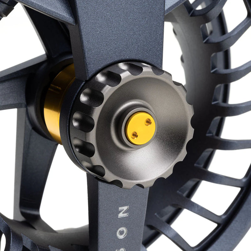 Load image into Gallery viewer, Lamson Liquid Max fly reel close-up of yellow spool center on dark frame

