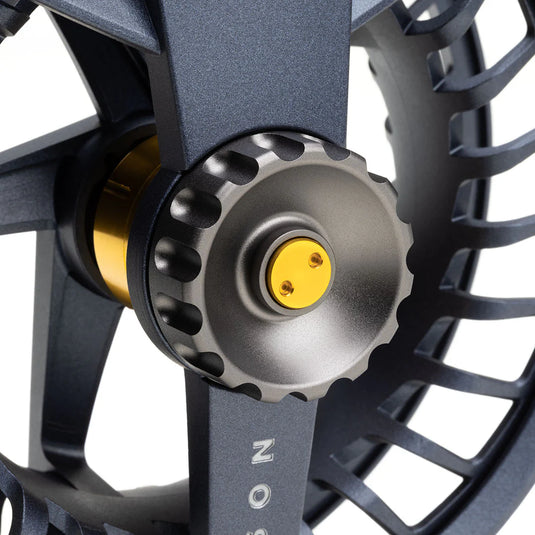 Lamson Liquid Max fly reel close-up of yellow spool center on dark frame
