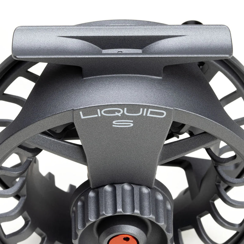 Load image into Gallery viewer, Fly fishing reel top front view with "LIQUID S" badge and orange center cap
