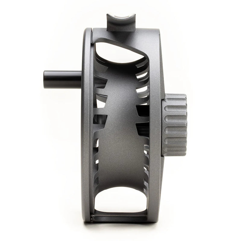Load image into Gallery viewer, Fly fishing reel side view with dark gray frame, open cutouts, and ridged adjustment
