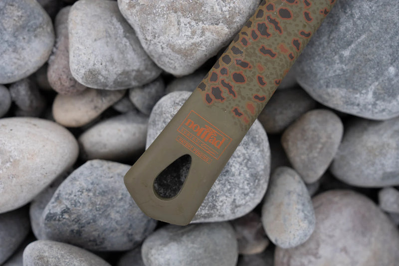 Load image into Gallery viewer, Fishing net handle end in brown camouflage with printed logo on gray rocks
