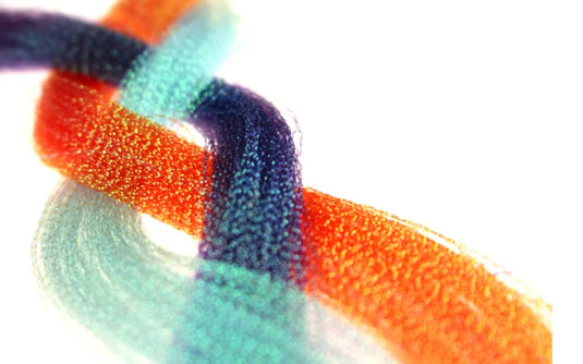 Orange, teal and dark blue beaded Crystalflash tassel close-up threads