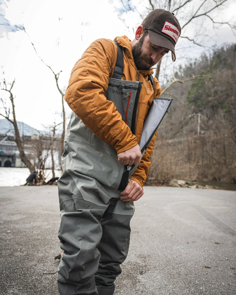 Load image into Gallery viewer, Simms Freestone Z stockingfoot wader in gray with black straps and red zipper accents
