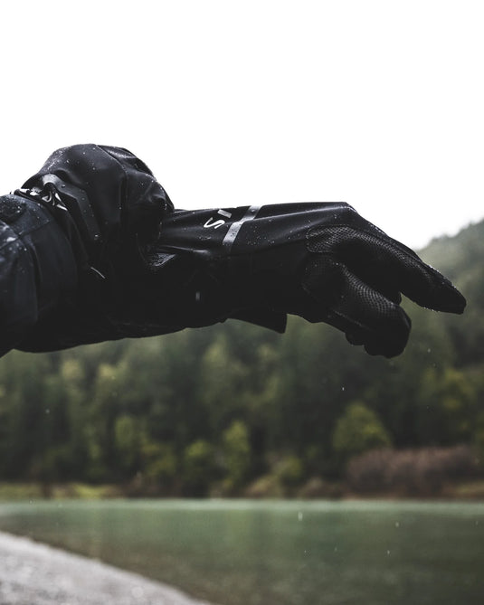 Black glove and liner with waterproof finish, water droplets on palm and knuckles